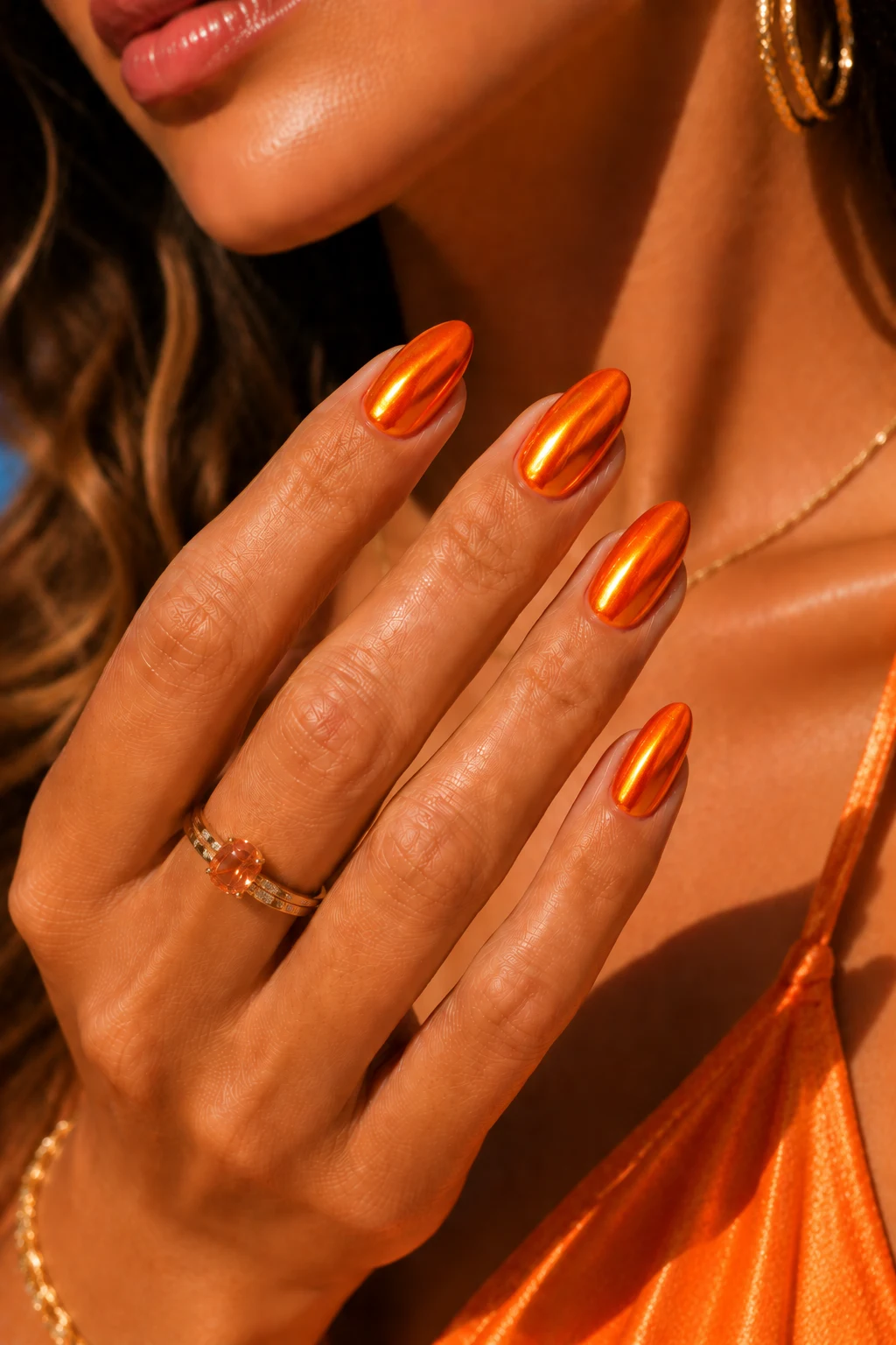 Orange Chrome Sunset Glow — orange nail ideas summer style outfit, worn by a stylish woman