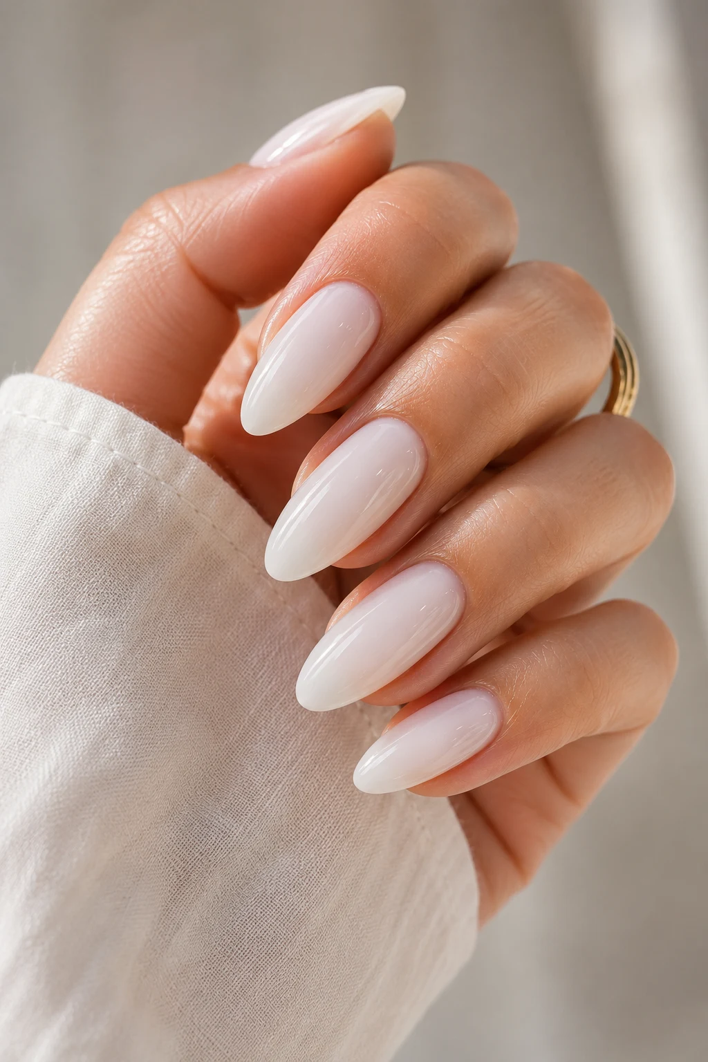 summer nails acrylic — Milky White Summer Nails Acrylic With Glossy Almond Tips — summer nails acrylic style outfit, worn by a stylish woman