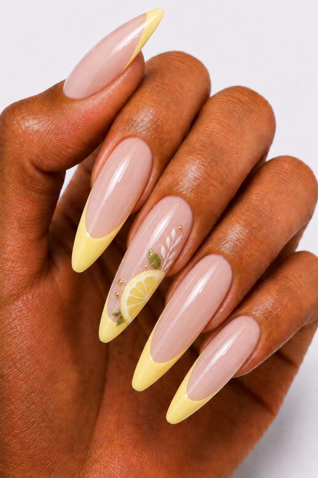 Milky Lemon French Tips — summertime gel nails style outfit, worn by a stylish woman