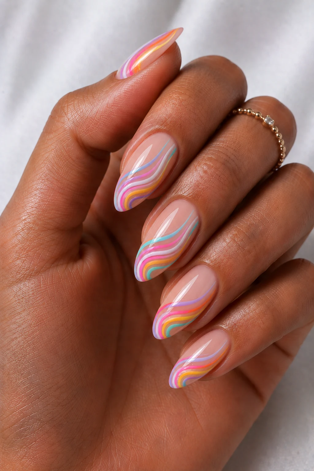 Cool Summer Nails Almond Rainbow Swirls — cool summer nails almond style outfit, worn by a stylish woman