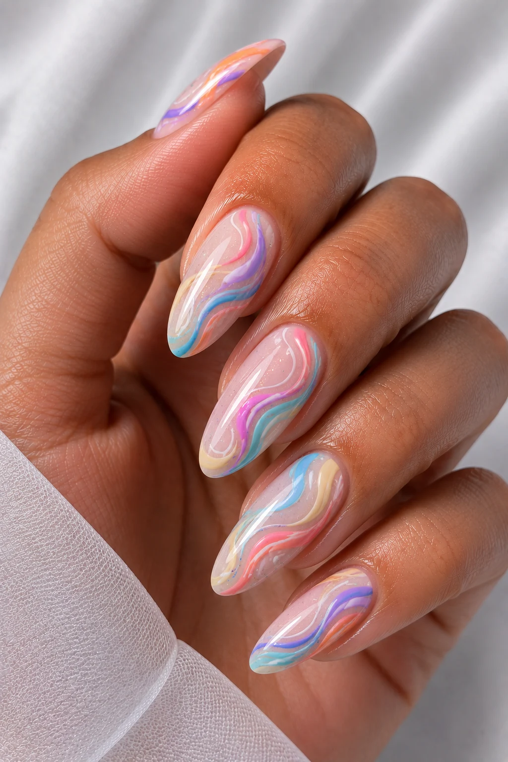 Cool Summer Nails Palette With Abstract Rainbow Swirls — cool summer nails palette style outfit, worn by a stylish woman