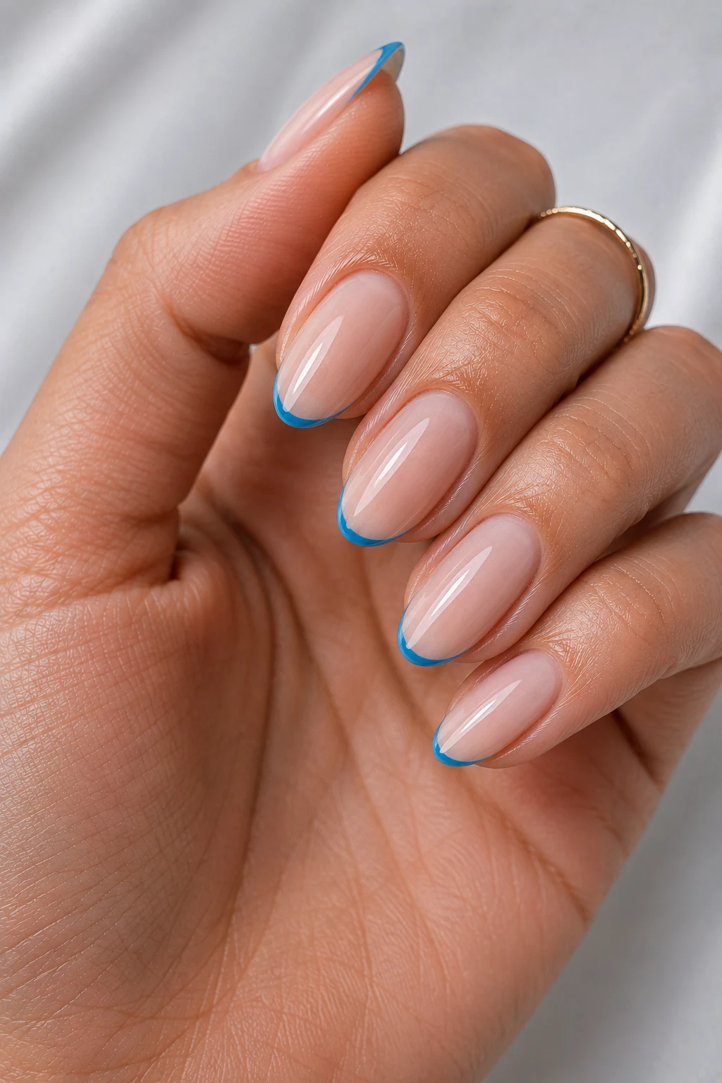 Ocean Blue Micro French — cool summer nails short style outfit, worn by a stylish woman