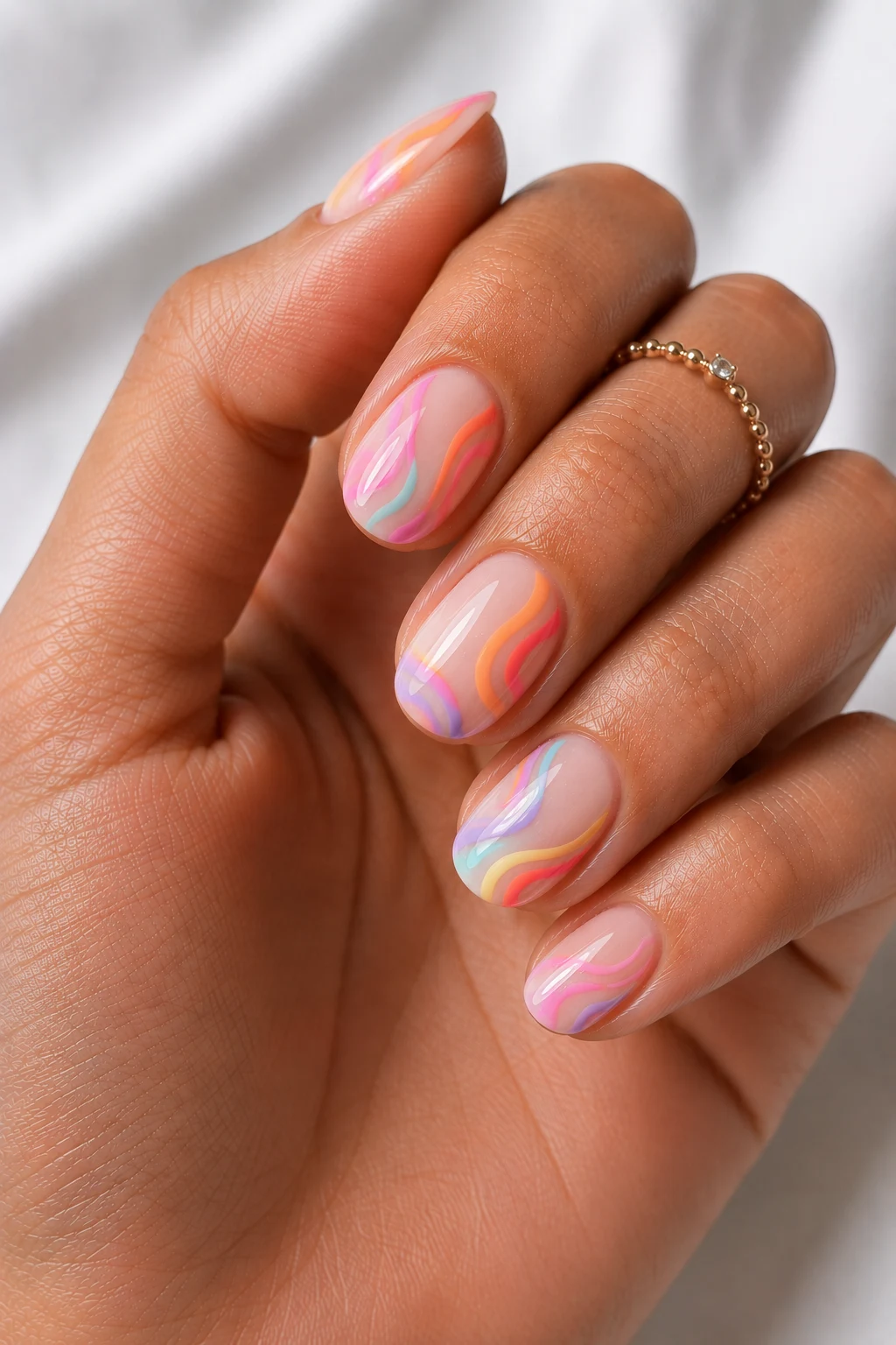 Cool Summer Nails Short Rainbow Swirls — cool summer nails short style outfit, worn by a stylish woman