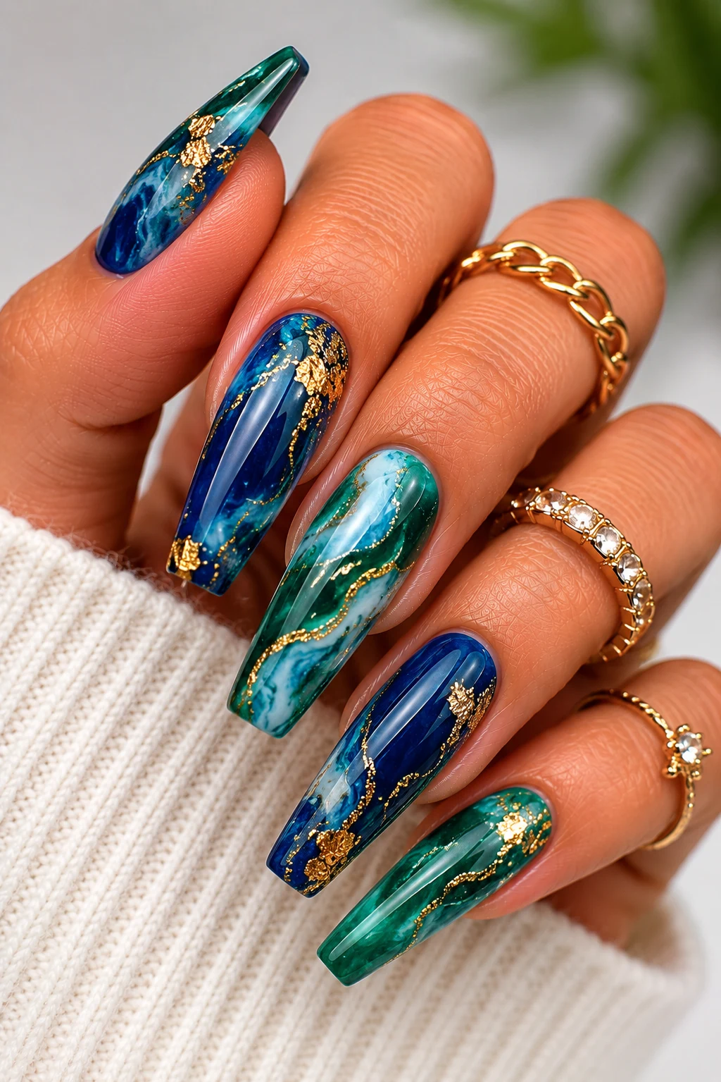 Emerald and Sapphire Marble Magic — green and blue nail ideas style outfit, worn by a stylish woman