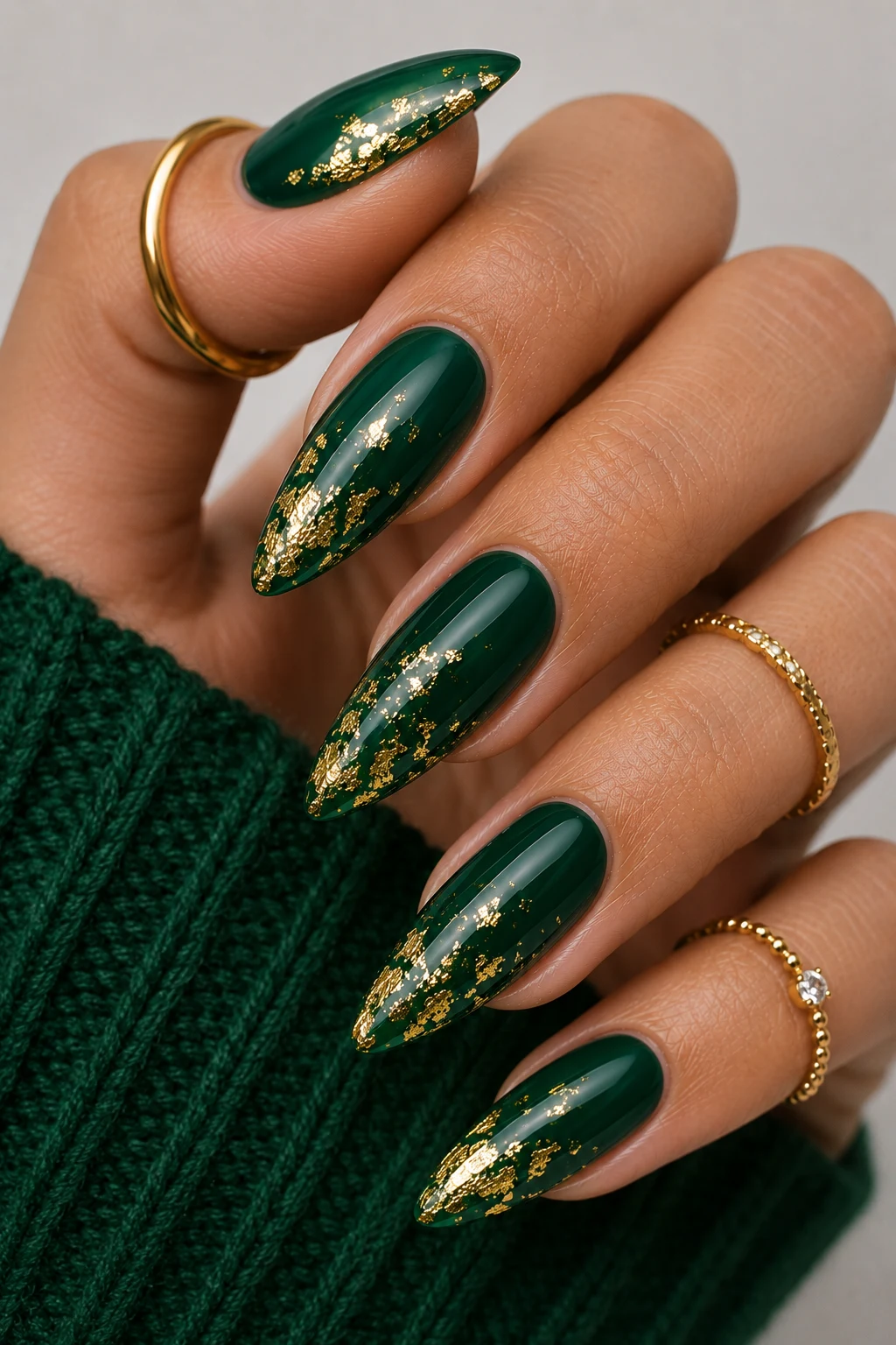 Green Christmas Nail Ideas With Gold Foil Sparkle — green christmas nail ideas style outfit, worn by a stylish woman