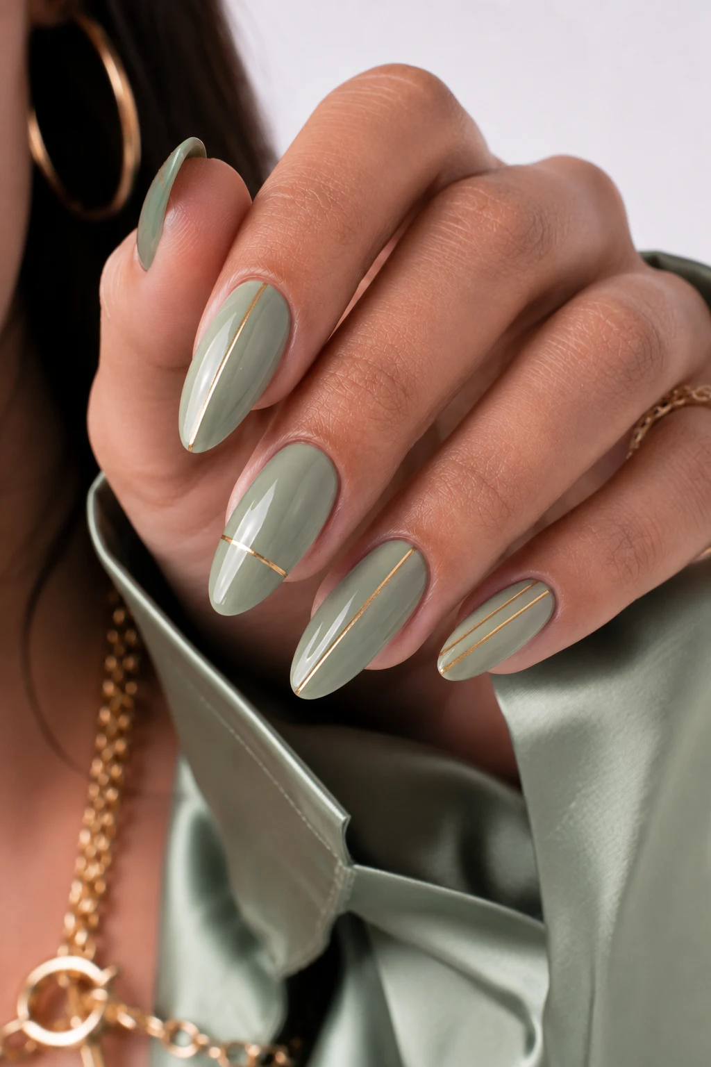 Sage Green and Gold Minimalist Chic — nail ideas green and gold style outfit, worn by a stylish woman