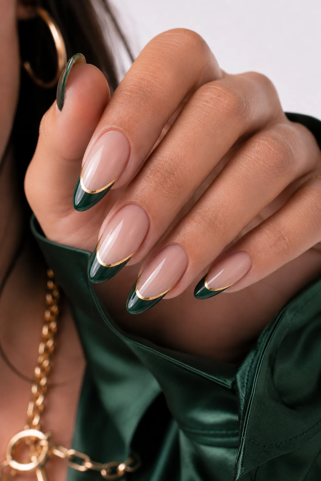 Green French Tips with Golden Edges — nail ideas green and gold style outfit, worn by a stylish woman