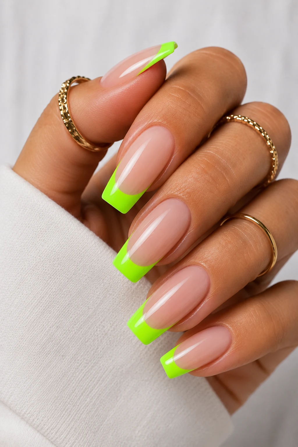 Modern Neon French Tips — neon green nail ideas style outfit, worn by a stylish woman