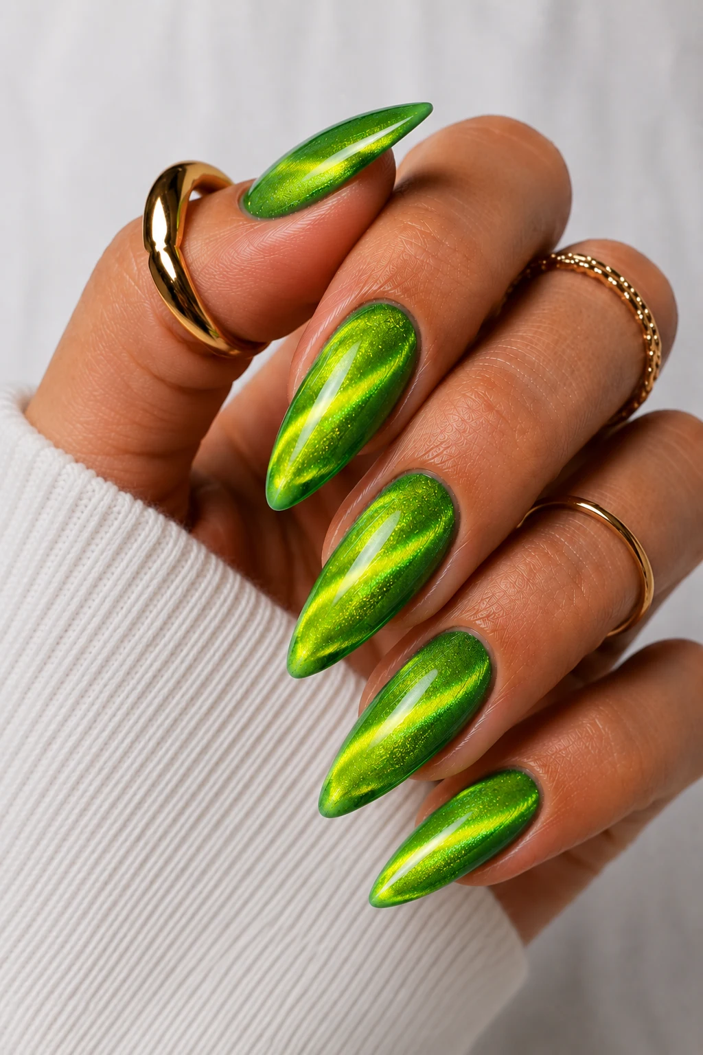 Neon Cat-Eye Galaxy Nails — neon green nail ideas style outfit, worn by a stylish woman