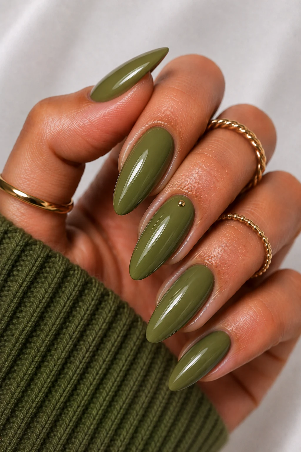Olive Luxe Minimalism — olive green nail ideas style outfit, worn by a stylish woman