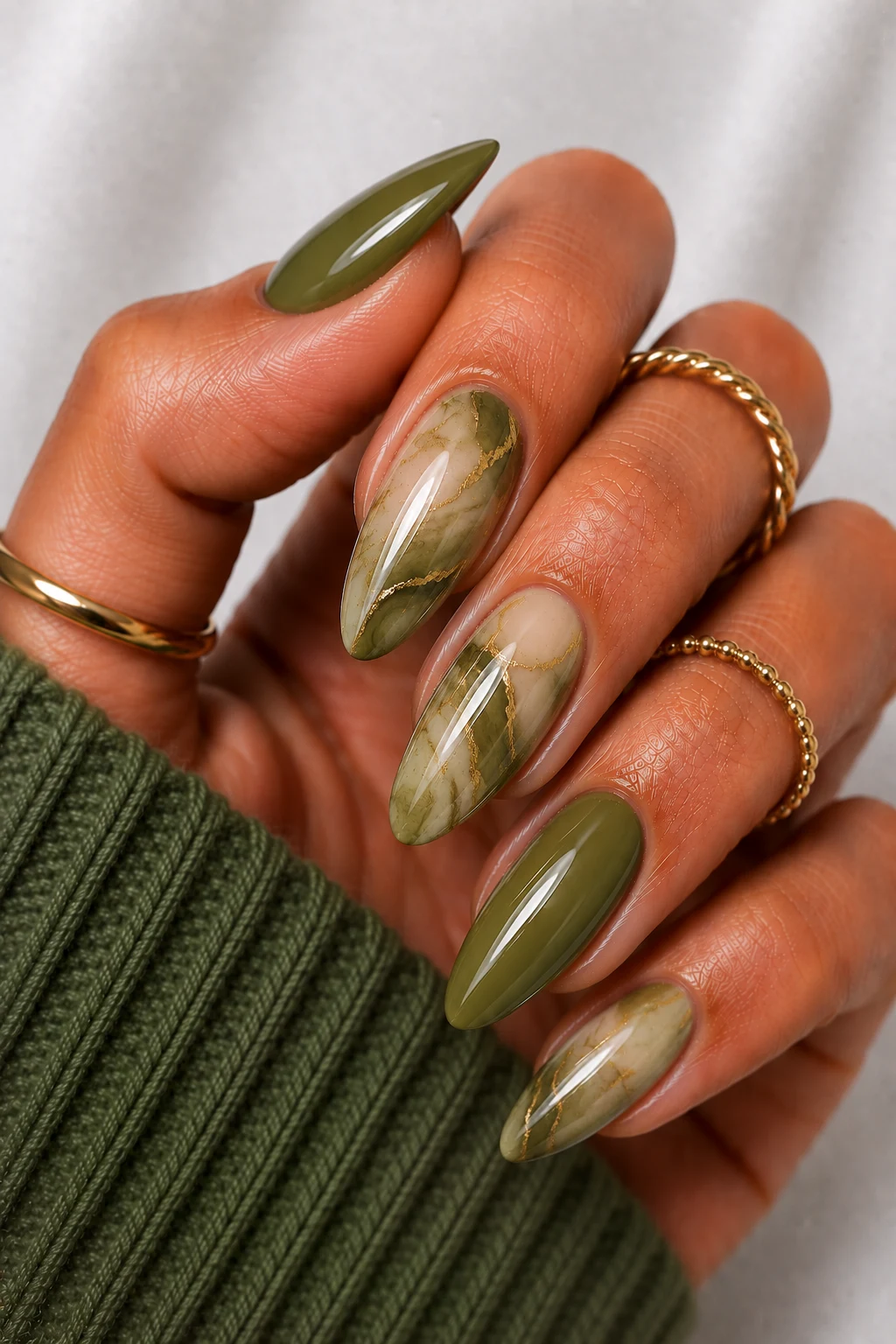 Olive Green Marble Dreams — olive green nail ideas style outfit, worn by a stylish woman
