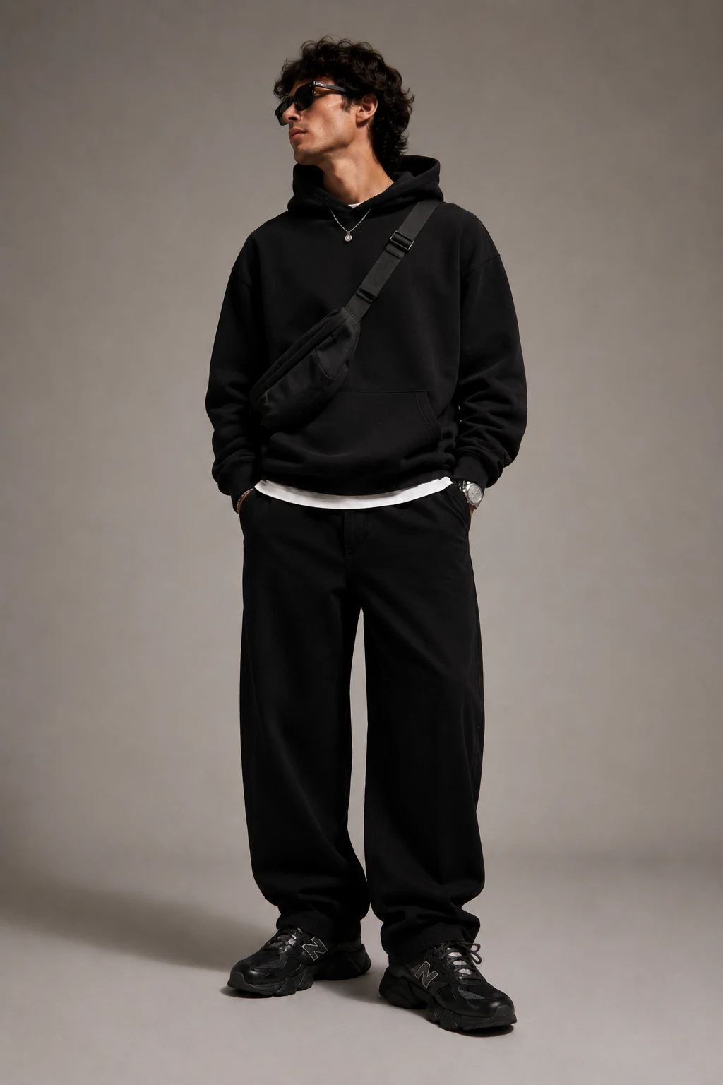 The All-Black Streetwear Uniform — new balance 9060 outfit men streetwear style outfit, worn by a stylish man