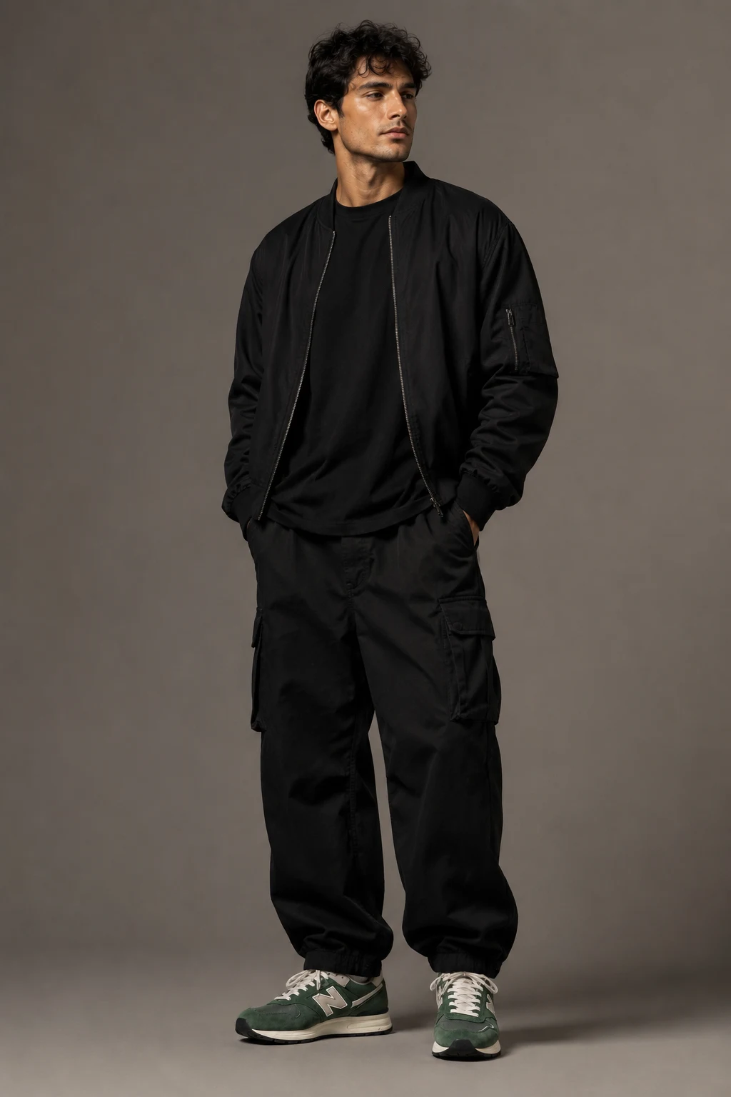 The Relaxed Black Streetwear Combo — new balance shoes men green style outfit, worn by a stylish man