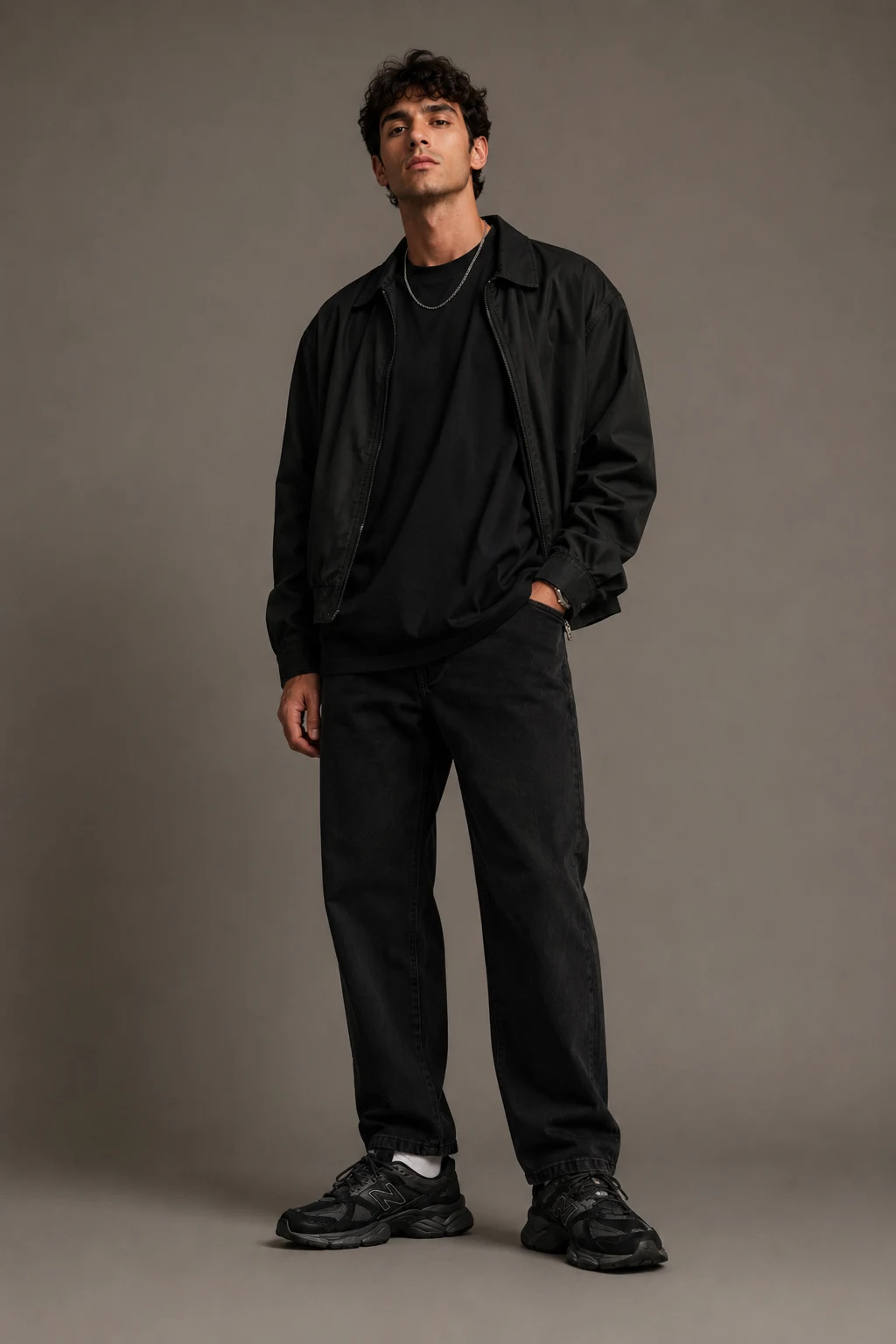 The Relaxed Black Monochrome Fit — outfits to wear with new balance 9060 men style outfit, worn by a stylish man