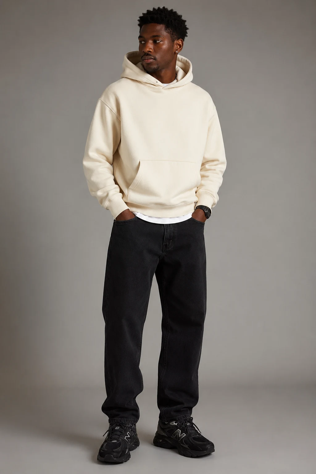 The Relaxed Cream Hoodie and Black Denim Combo — Outfits With 9060 New Balance Black Men style outfit, worn by a stylish man