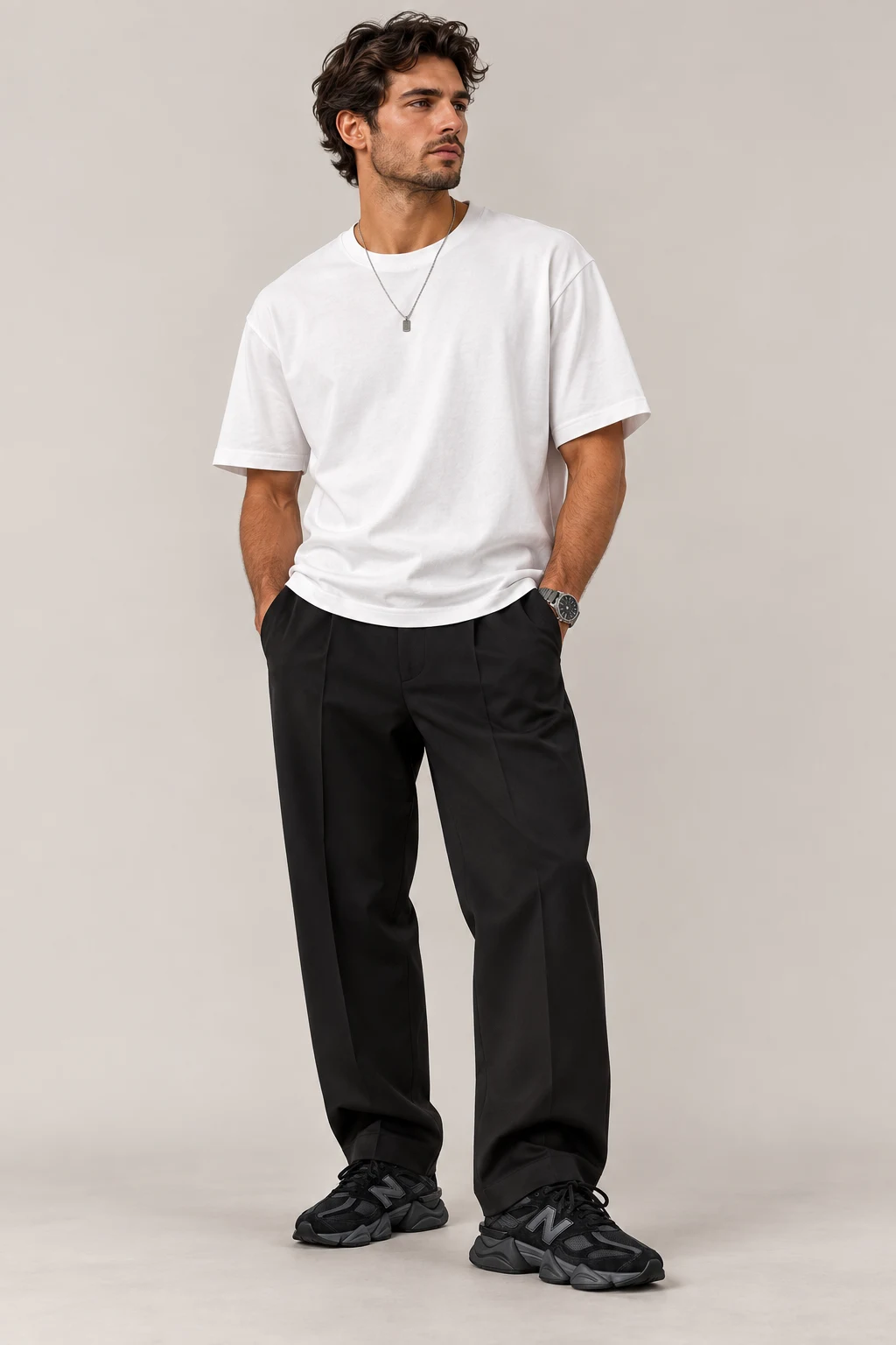 The Minimal White Tee and Black Trouser Look — Outfits With 9060 New Balance Black Men style outfit, worn by a stylish man