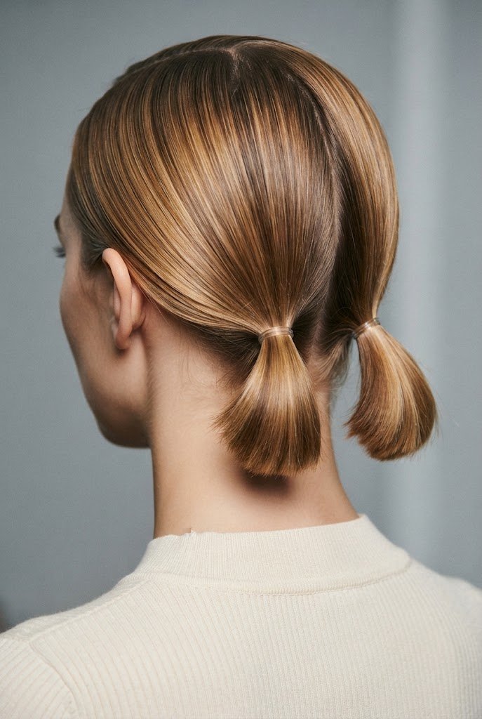 The Sleek Low Twin Ponies — short hair two ponytails style outfit